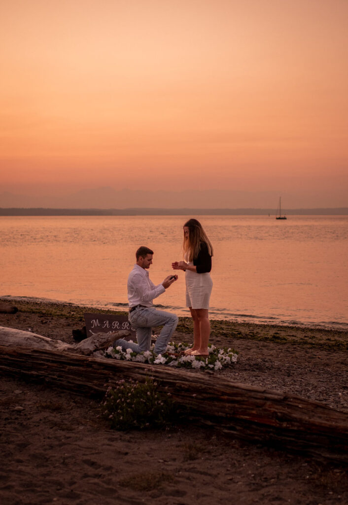 Couple during surprise proposal at beach in WA