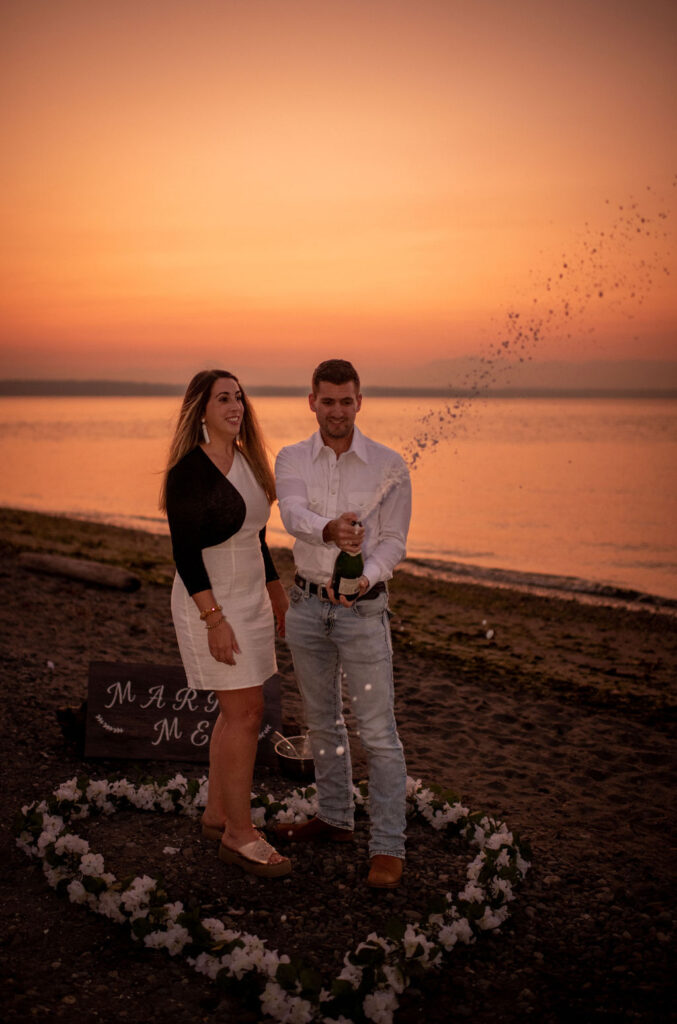 Couple popping champagne after surprise proposal in Seattle