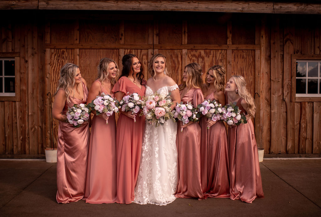 Bride and bridesmaids posing for wedding photos at Hillside Farms wedding venue in Washington