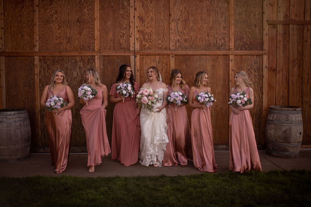 Bride and bridesmaids posing for wedding photos at Hillside Farms wedding venue in Washington