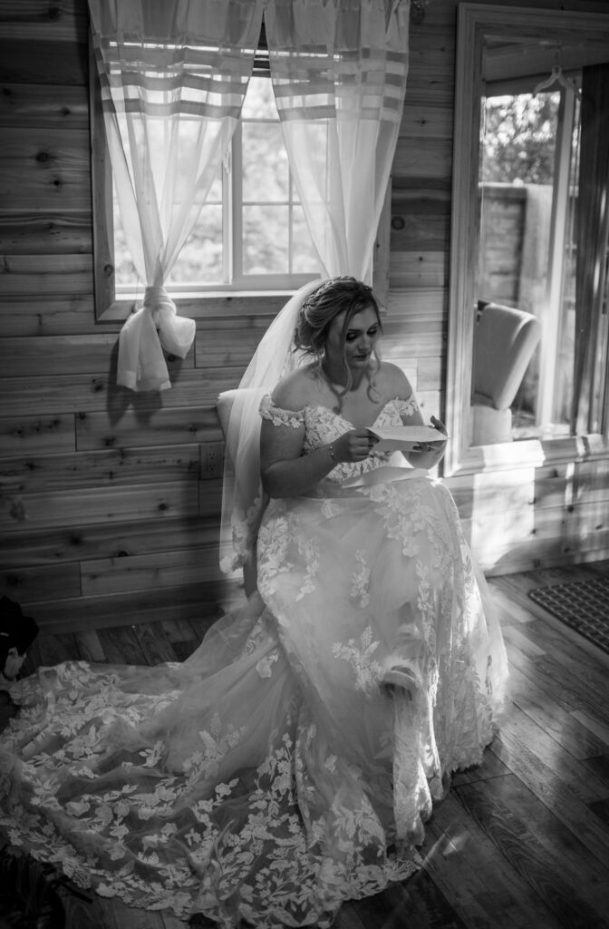 Bride reading wedding letter from groom