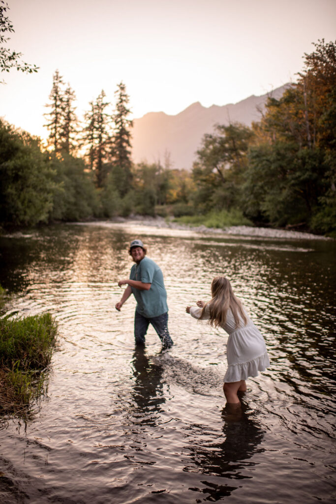 Couple in the river during engagement session