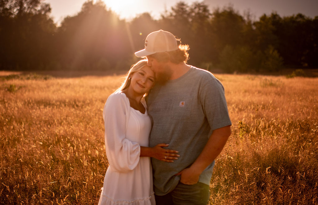 Couple posing for golden hour engagement photos in the fields of Washington