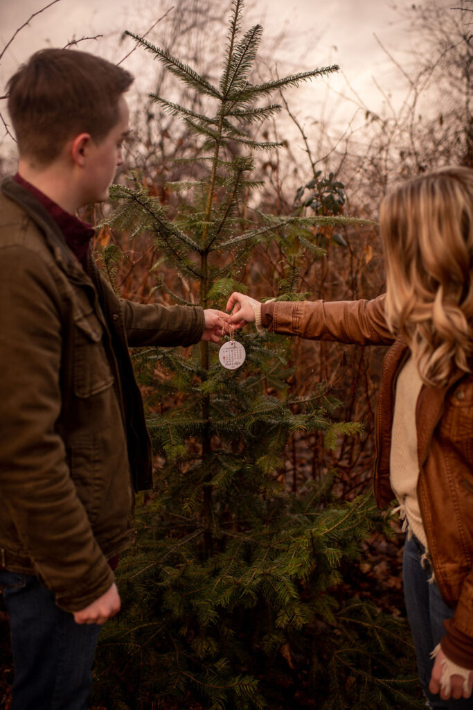 Couple hanging Custom engagement date ornament on tree