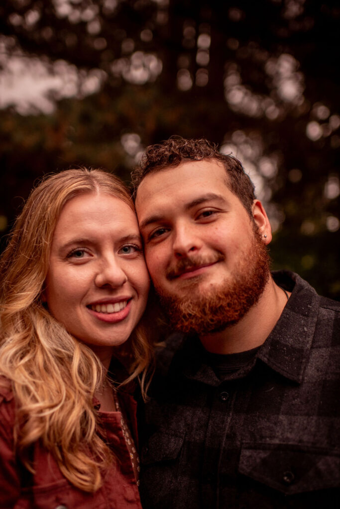engaged couple happy face during their fall engagement photoshoot