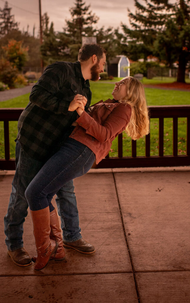 engaged couple dancing during their fall engagement photoshoot