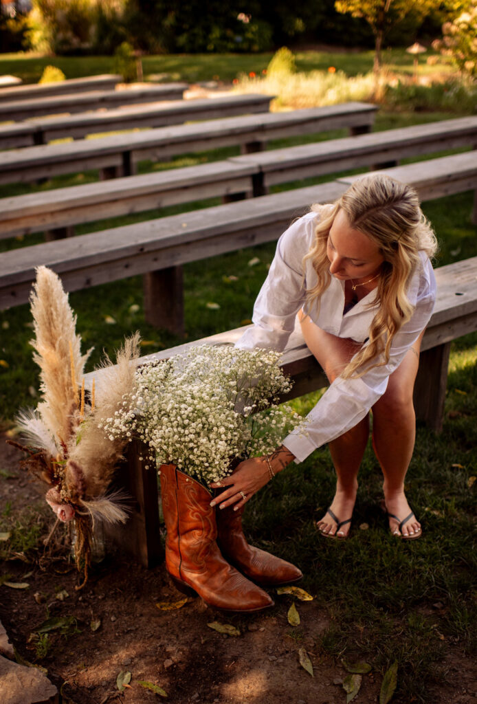Bride finishing a bouquet before her ceremony