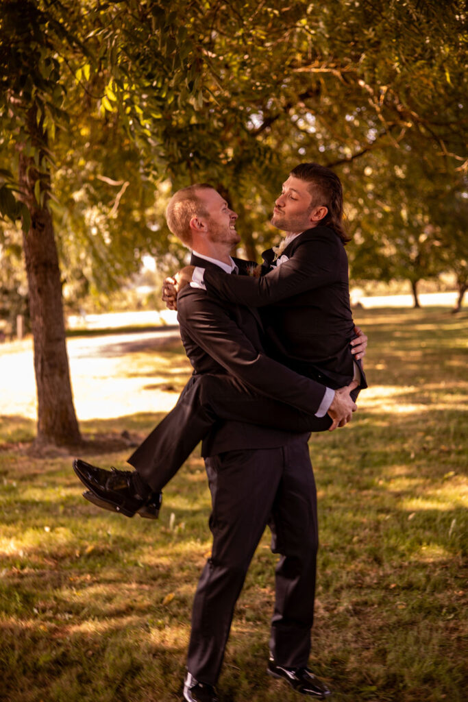 groom carrying one of his friends 