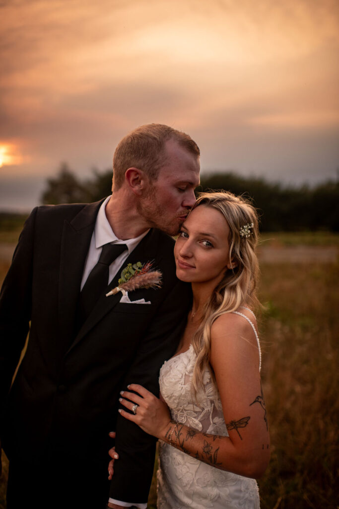 Close portrait of the bride and groom during sunset