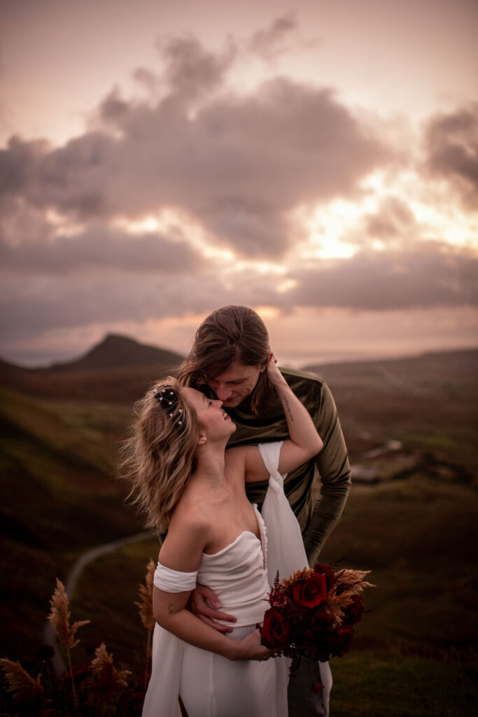 couple kissing during their adventurous elopement session 